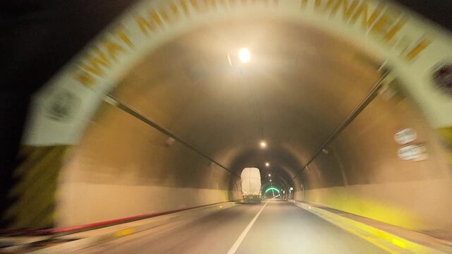 Swat Motorway Tunnel 1 with bright overhead lights and clear road markings along the M‑16 route in Malakand, Khyber Pakhtunkhwa.