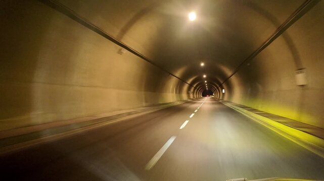 Swat Motorway Tunnel 1 with bright overhead lights and clear road markings along the M‑16 route in Malakand, Khyber Pakhtunkhwa.