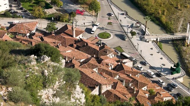 Historic white buildings with shingle roofs of Berat old town in Albania