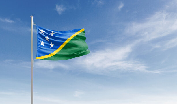 Solomon Islands national flag waving in the sky.