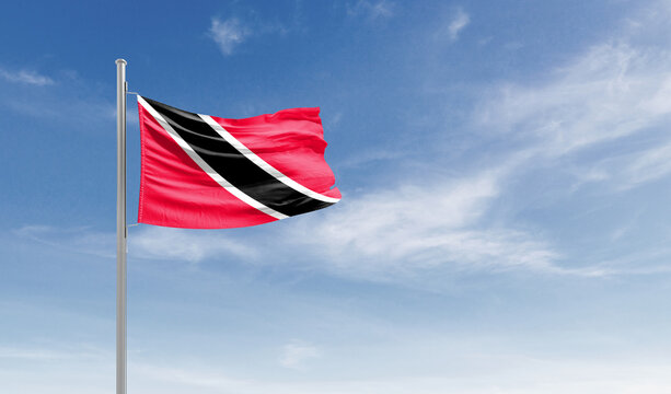 Trinidad and Tobago national flag waving in the sky.