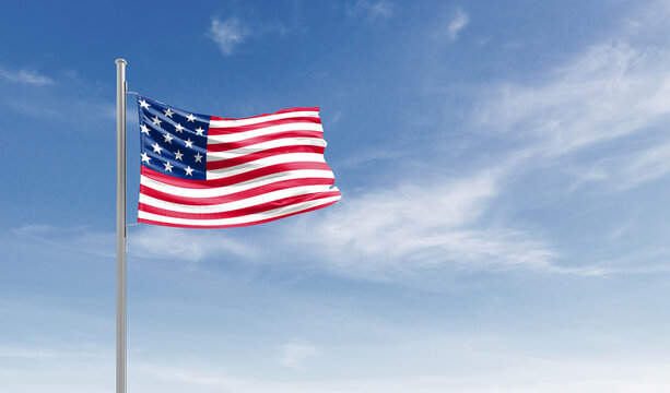 United States national flag waving in the sky.