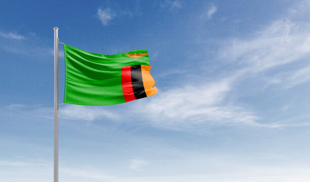 Zambia national flag waving in the sky.