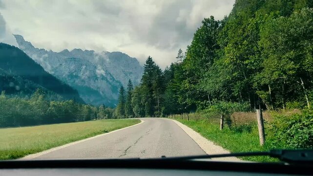 Breathtaking panoramic view of green Logar valley and high alpine mountain peaks in Slovenia