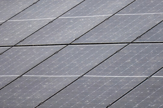 Rooftop solar panels during a torrential downpour.