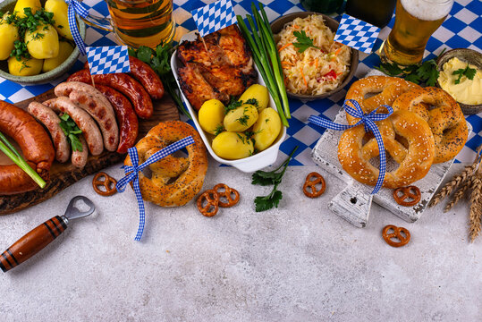 Oktoberfest food: beer, pretzel, sausages, stewed cabbage, potato