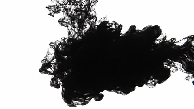 Black ink diffusing into clear water. Abstract liquid cloud expanding and swirling in liquid. Experimental fluid dynamic effect for design and creative background.