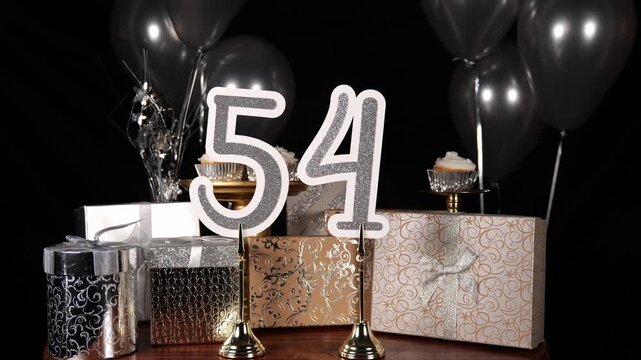 Silver Number 54 with Silver Glitter Sparkles with Gifts and Balloons and Cupcakes for Party Fifty Four