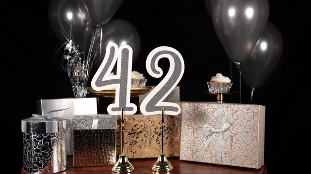 Silver Number 42 with Silver Glitter Sparkles with Gifts and Balloons and Cupcakes for Party Forty Two