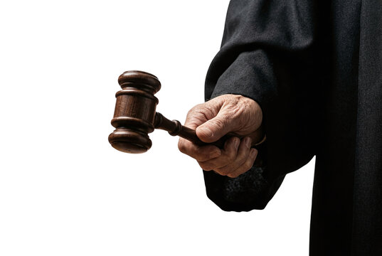 Judge hand holding wooden gavel in black robe