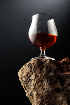 Cognac resting on a piece of natural granite rock.