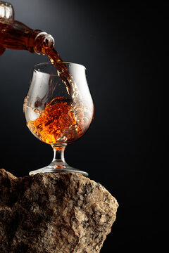 Cognac resting on a piece of natural granite rock.