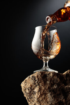 Cognac resting on a piece of natural granite rock.