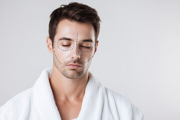 Obraz premium Male patient undergoing facial feminization or masculinization assessment, cosmetic surgery roadmap, facial proportions analysis, aesthetic planning, modern clinic portrait 