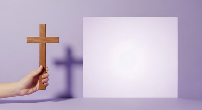 hand holding a wooden cross symbolizing Good Friday
