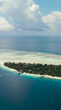 Aerial drone of beautiful island with sandy beach in tropical sea. Mataking islet.Tun Sakaran Marine Park. Borneo, Sabah, Malaysia. Vertical video.