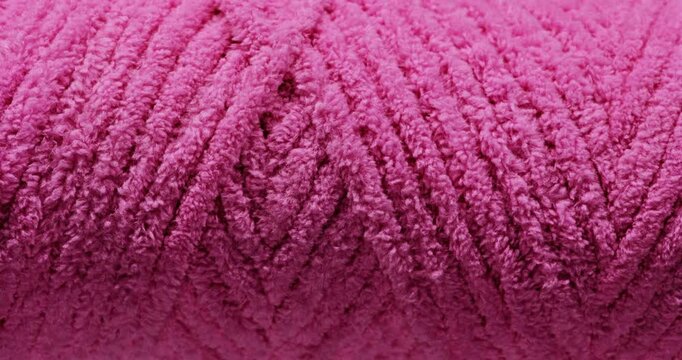 Pink Chenille Yarn Texture. Macro view of soft fuzzy yarn fibers with dense plush surface and slow camera movement.
