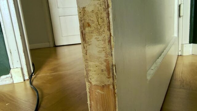 Close-up of Partly Stripped Painted Door Frame in Renovation