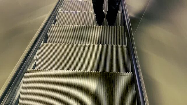 Moving Escalator Steps and Handrail Inside Metro Station