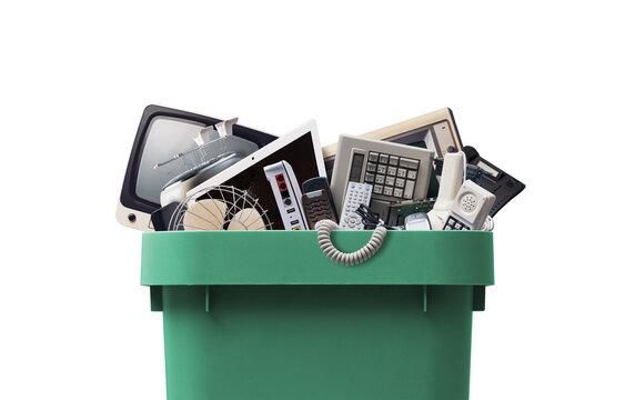 E-waste Recycling Concept with Old Electronic Devices and Household Appliances in Green Bin