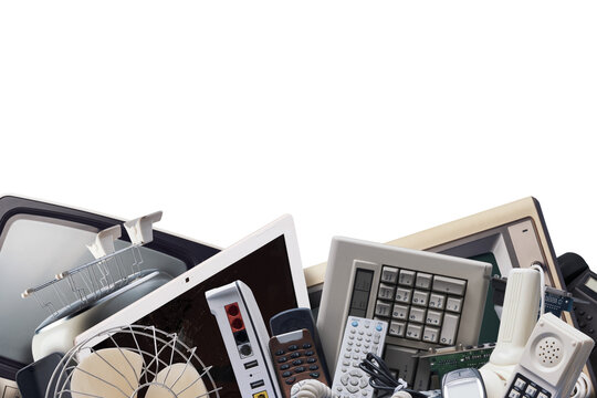 Electronic Waste Heap Concept with Discarded Tech Devices over Green Background