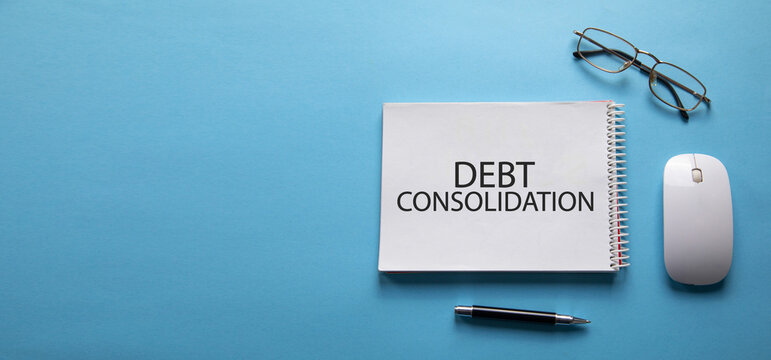 Debt Consolidation message on notepad. Business concept