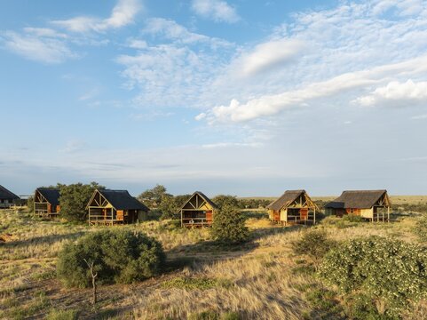 The Ta Shebube Rooiputs Lodge in the Kalahari Desert during the rainy season with green vegetation. Aerial view. Drone shot. Kgalagadi Transfrontier Park, Botswana
