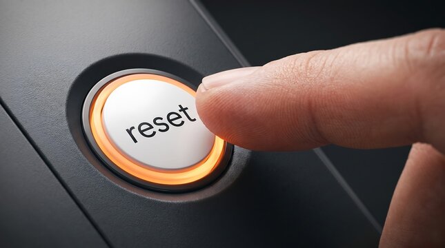 Finger Pressing Reset Button on Tech Device for System Restart and Fresh Start Concept Background for Website Banner Use