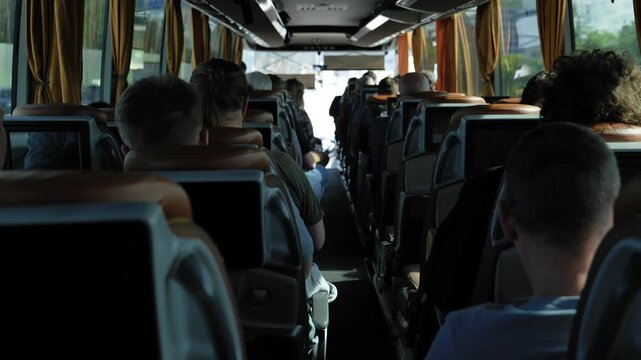 Passengers traveling on a long-distance bus, experiencing public transportation journey