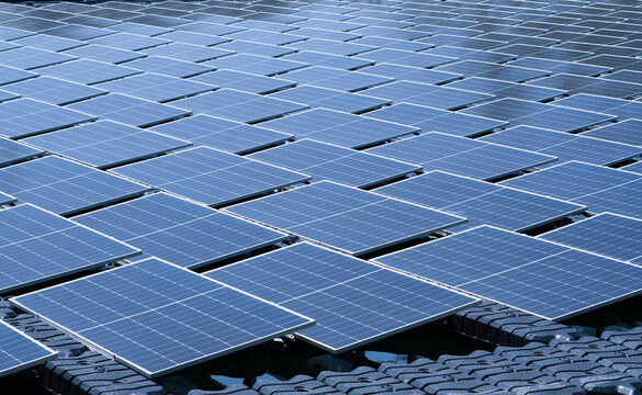 solar panels covering a water reservoir, generating clean renewable energy with advanced photovoltaic technology. Sustainable power, green infrastructure, carbon reduction, and future energy solutions