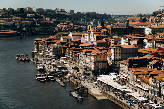 Golden hour sunset over the Douro river and Porto cityscape, Portugal.