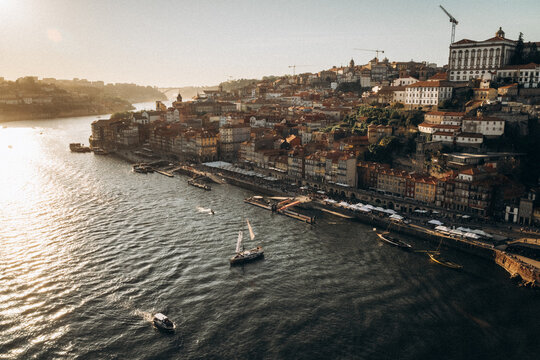Golden hour sunset over the Douro river and Porto cityscape, Portugal.