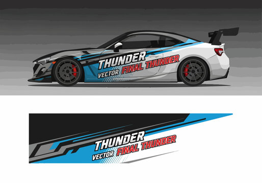 White sports car with blue racing decals and spoiler