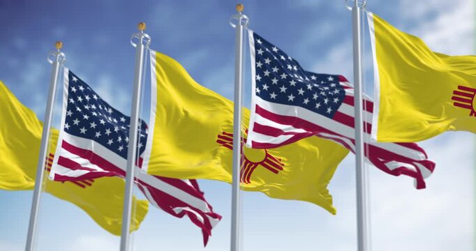 Close-up view of the New Mexico and United States flags waving