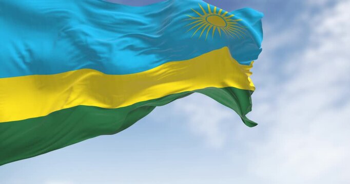 Close-up of Rwanda national flag waving on a clear day