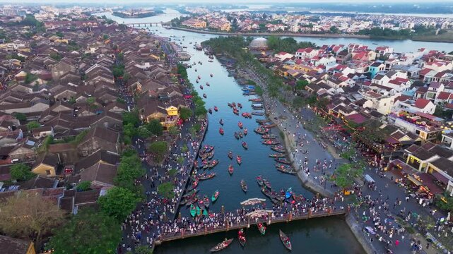 Spectacular drone view of Hoi An Ancient Town and Thu Bon River at sunset, Vietnam