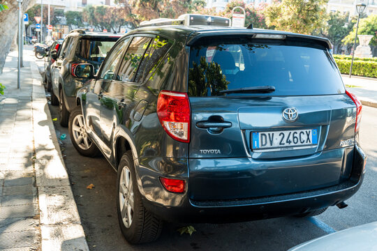 Bari, Italy - June 31, 2026: Toyota RAV4 SUV parked on city street with Italian license plate DV 246CX visible on rear bumper in urban setting