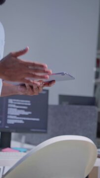Software Developer reading note report and verifying coding on screen computer technology at office. Programmer working writing code analysis system artificial intelligence. Software engineer present