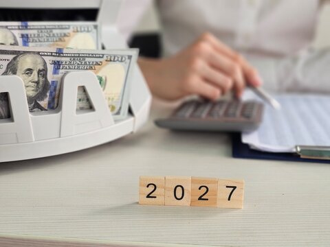 Business planning for future goals with cash and calendar