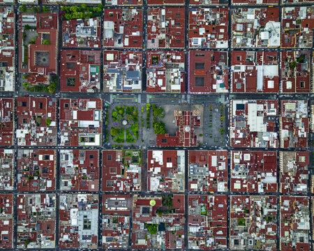 Aerial view of Plaza de Armas surrounded by historic colonial architecture and dense red-tiled rooftops in Morelia, Michoacan, Mexico.