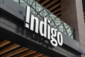 Fototapeta premium Toronto, Ontario, Canada - August 5, 2026: Closeup Indigo book store sign on the building in Toronto, Ontario, Canada. Indigo Books and Music is Canada's largest book retailer. 