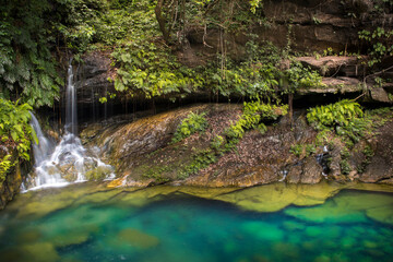 Poço Azul, Rio Cocal, Maranhão, Brazil. A magical place where a small waterfall cascades in a turquois jungle pool at the bottom of the River Cocal canyon. © Rob