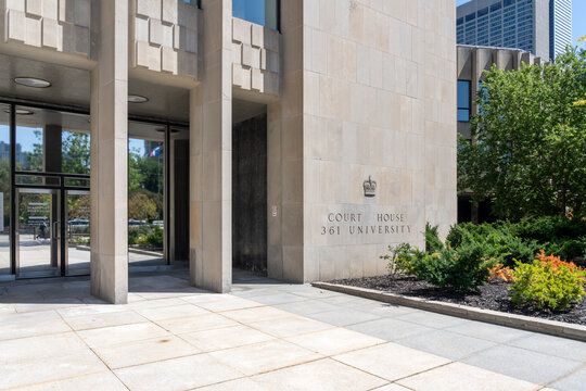 Toronto, Ontario, Canada - August 5, 2026: The main entrance of the Toronto Courthouse which houses the Ontario Superior Court of Justice at 361 University Avenue in downtown Toronto, Canada. 
