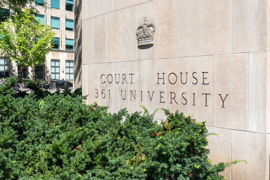 Toronto, Ontario, Canada - August 5, 2026: The signage for Toronto Courthouse which houses the Ontario Superior Court of Justice at 361 University Avenue in downtown Toronto, Canada. 