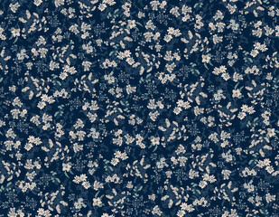Delicate white floral pattern on deep navy background with subtle green accents for textile design © Creativezone