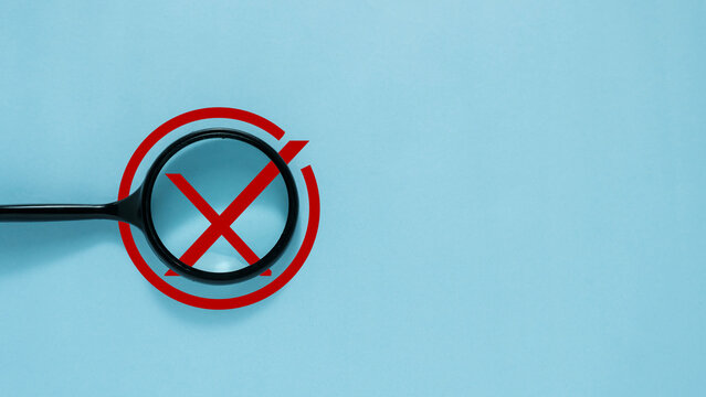Rejected Verification Concept with Magnifying Glass, Red Cross Mark, Validation Failure and Quality Control Inspection
