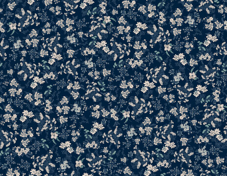Delicate white floral pattern on deep navy background with subtle green accents for textile design