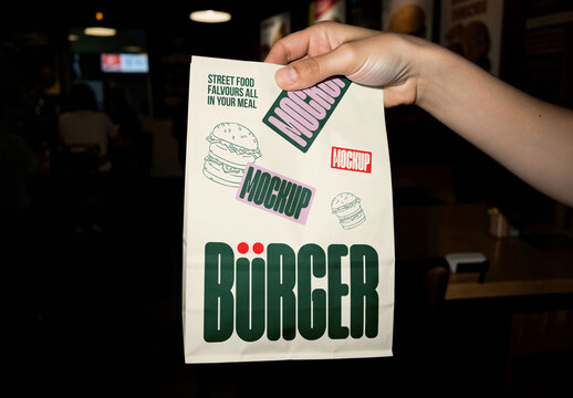 Hand Holding Take Away Bag Mockup