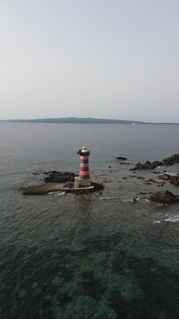 Portoscuso Lighthouse Overlooking the Mediterranean Sea and San Pietro Island
