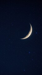Naklejka premium Detailed crescent moon showing craters against deep dark blue starry night sky background. Concept of astronomy, outer space, celestial night landscape, and cosmos exploration.